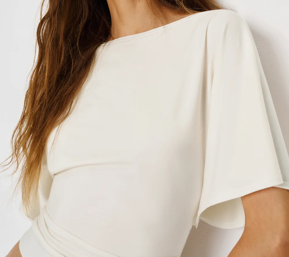 Stretch-knit top with tie back waist