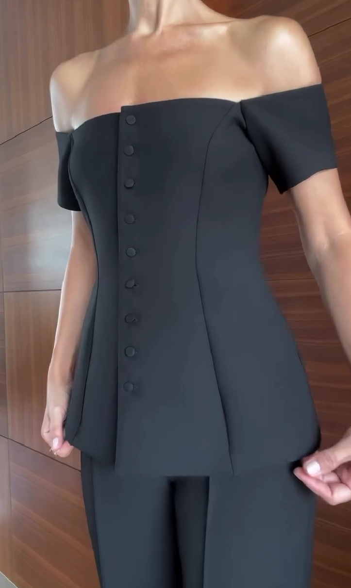 One-shoulder suit with multiple buttons and trousers