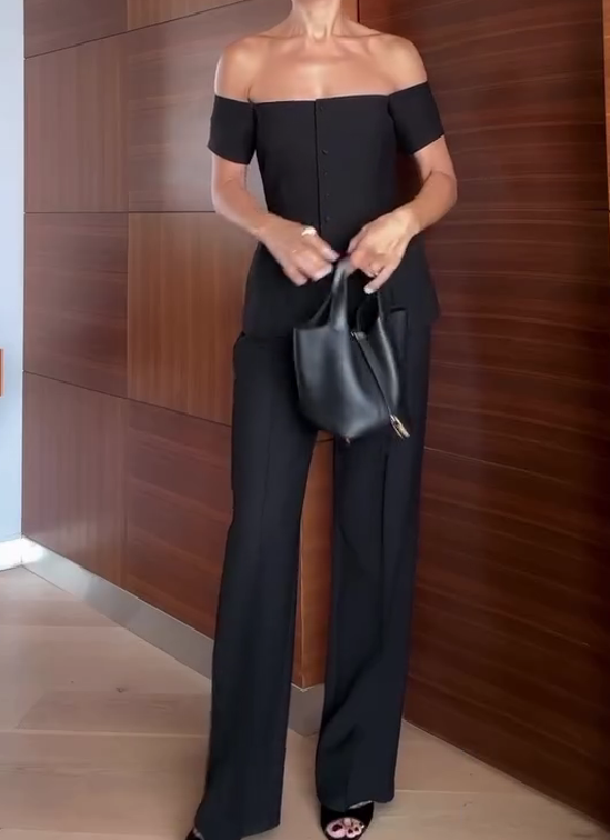 One-shoulder suit with multiple buttons and trousers