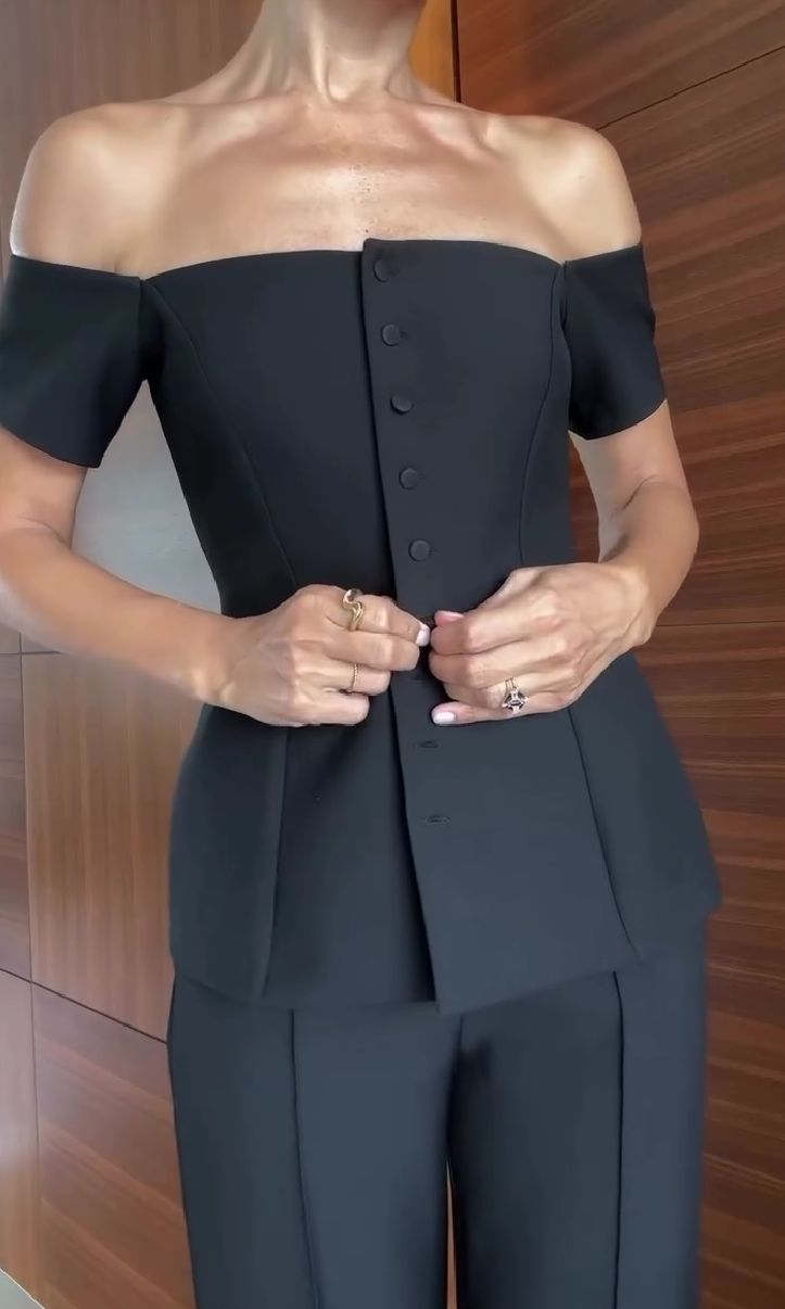One-shoulder suit with multiple buttons and trousers