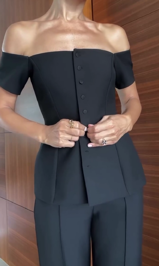 One-shoulder suit with multiple buttons and trousers